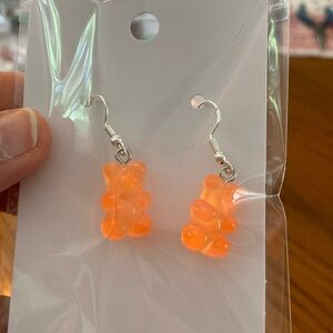 Bright Orange Gummy Bear ” earrings.